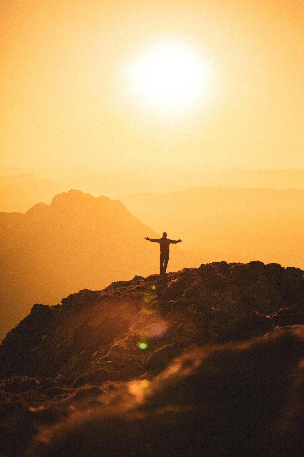 silhouette-freespirited-hiker-top-mountain-golden-sunset_181624-60215